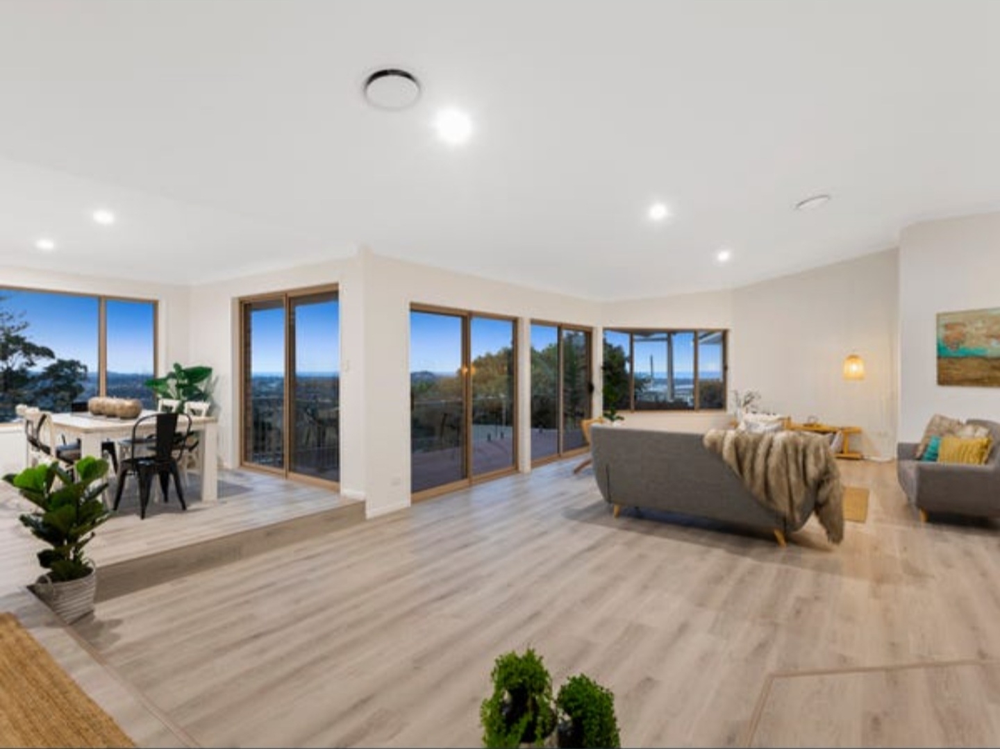 Bright living room with fresh white walls and big windows