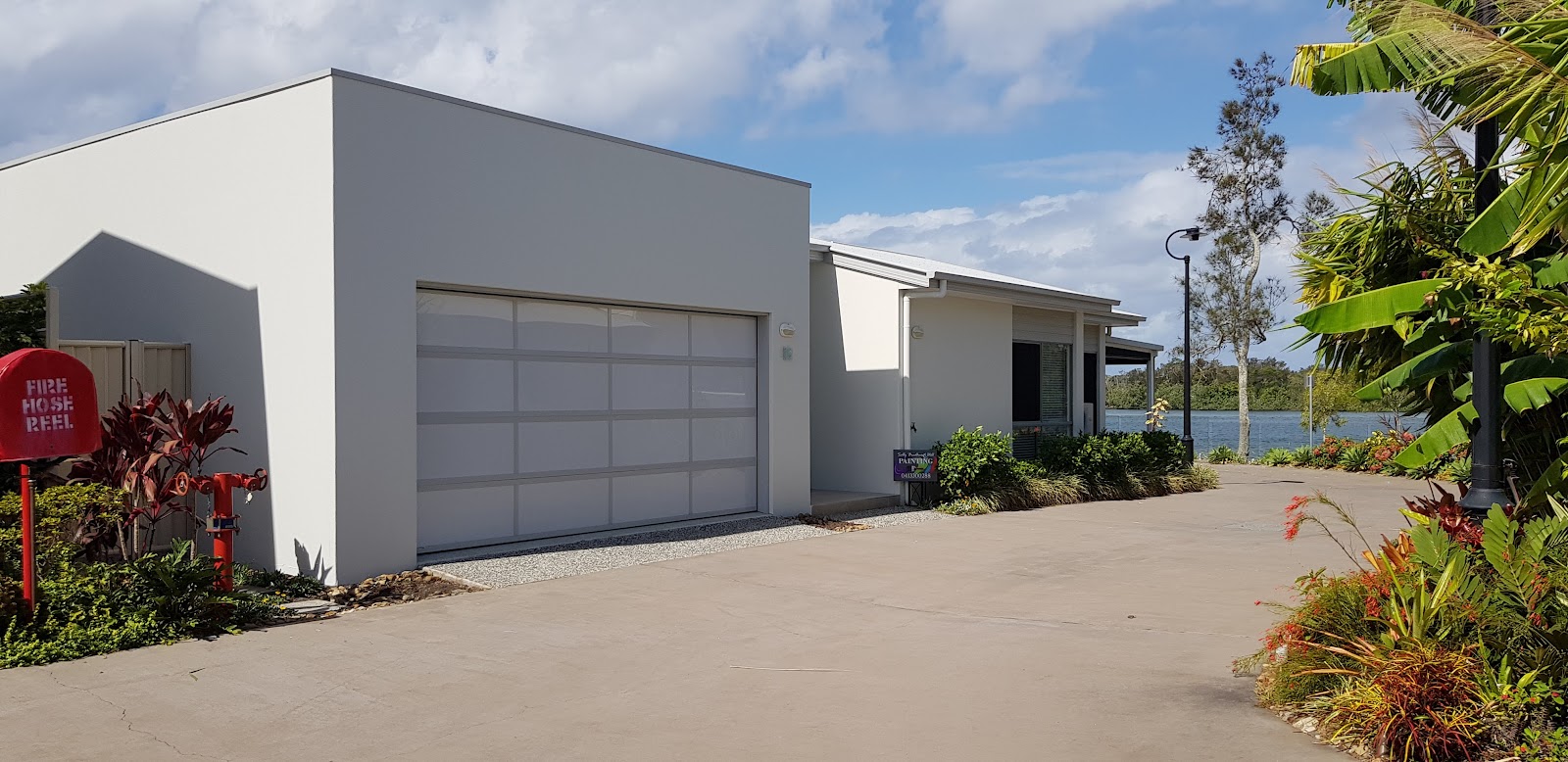 Rendered garage and unit exterior freshly painted grey